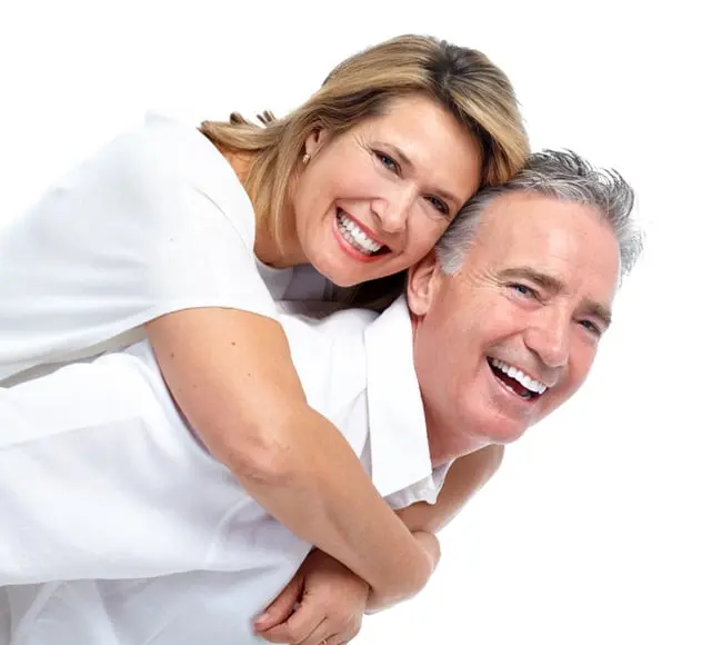 Happy middle-aged couple smiling and embracing each other, radiating warmth, joy, and affection in a loving moment